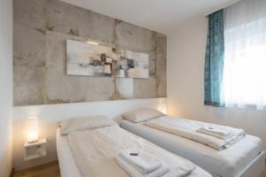 מיטה או מיטות בחדר ב-Design-Apartments Graz