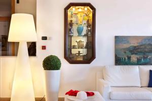 a living room with a white lamp and a couch at Hotel Rivage in Sorrento