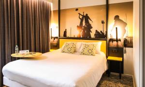 Postel nebo postele na pokoji v ubytování Ibis Styles Clermont-Ferrand République