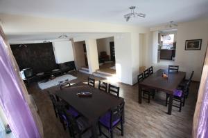 an aerial view of a living room with tables and chairs at Ashkova House in Govedartsi +31 photos