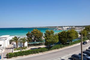 a view of the beach from the balcony of a building at Residenza Del Mare in Sant'Isidoro