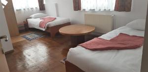 Postel nebo postele na pokoji v ubytování Coroian House