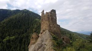 an old stone building on top of a mountain at Oasis in Aspindza