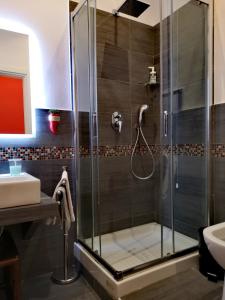 a bathroom with a shower and a sink at Grande Archivio Napoli 22 in Naples