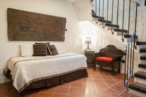 Cama o camas de una habitación en Los Olivos Boutique Hotel Antigua Guatemala