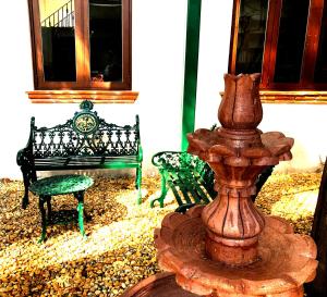 a fire hydrant sitting on top of a wooden table at Casa Jacinta Guest House in Mexico City