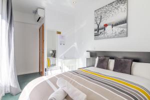 Postel nebo postele na pokoji v ubytování AYZ Javier Cabrini - Auto check-in property + 37 fotografií