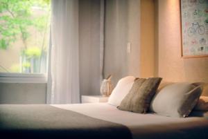 Una cama o camas en una habitación de Plenilunio Mar de las Pampas