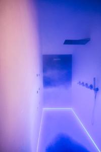 a white bathroom with a tub with a knife at COCCA - Le charme de Casa Mia in Polignano a Mare