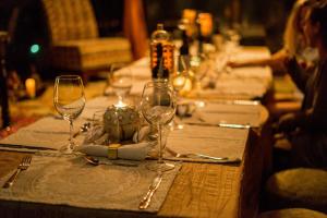 a table with wine glasses on top of it at Vida Mountain Resort & Spa Adults Only in San Ramón