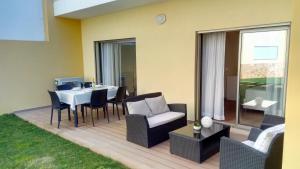 Et opholdsområde på Apartamento O Jardins da Marina