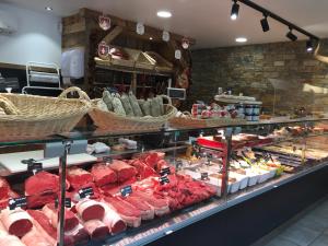 a display case in a store filled with lots of food at ECRINS ETOILE C9 in Samoëns