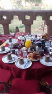 a table with plates of food on top at Gite D'Etape Amced in Goulmima
