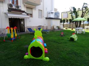 a backyard with a playground with a play equipment at Palazzina del sole in Sottomarina