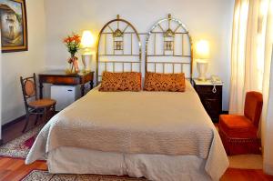 Postel nebo postele na pokoji v ubytování Parador Santa Maria La Real