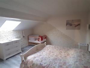 Katil atau katil-katil dalam bilik di La belle endormie - appartement A