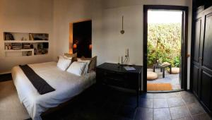 En eller flere senger på et rom på B&B La Mimosa