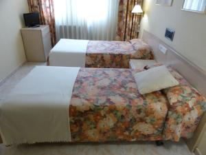 Posteľ alebo postele v izbe v ubytovaní Hotel La Brañina