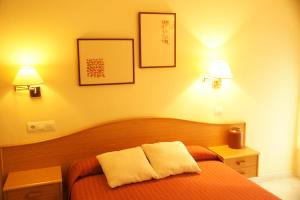 Posteľ alebo postele v izbe v ubytovaní Hotel La Brañina