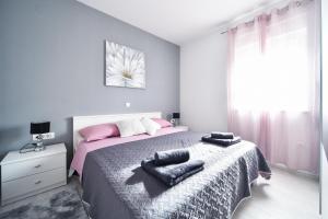 Postel nebo postele na pokoji v ubytování Deluxe Apartments Franić