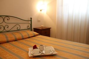 A bed or beds in a room at Hotel I Platani