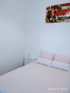 Un pat sau paturi într-o cameră la Valencian Dreams Lonja