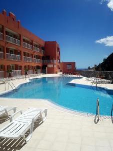 a large swimming pool in front of a building at Casa Storm in Costa Calma