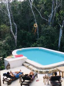 Kolam renang di atau di dekat Casa Tzalam Tulum selva