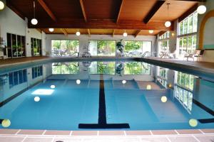 The swimming pool at or close to Eastland Suites Extended Stay Hotel & Conference Center Urbana