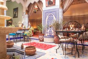 a room with blue and white tiles on the floor at Riad Mahjouba Marrakech & SPA in Marrakesh