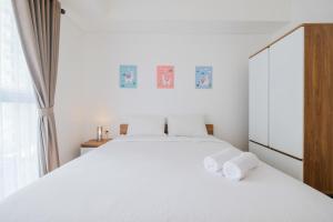 Ένα ή περισσότερα κρεβάτια σε δωμάτιο στο Simple Furnished Studio Casa De Parco Apartment By Travelio +15 φωτογραφίες