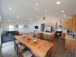 a large kitchen and living room with a wooden table at Mountain Place in Groveland
