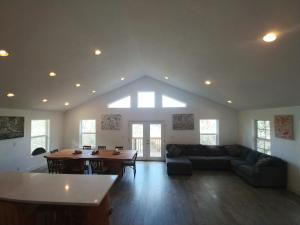 a living room with a couch and a table at Mountain Place in Groveland