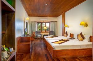 Letto o letti in una camera di Ta Prohm Hotel & Spa