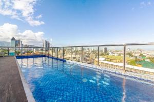 a large swimming pool on top of a building at RedDoorz Plus @ Jones Avenue Cebu in Cebu City