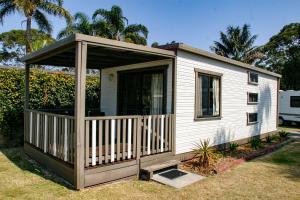 a screened in porch on a tiny house at Ingenia Holidays Shoalhaven Heads in Shoalhaven Heads