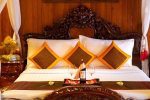 Letto o letti in una camera di Ta Prohm Hotel & Spa
