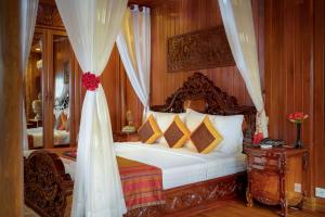 Letto o letti in una camera di Ta Prohm Hotel & Spa