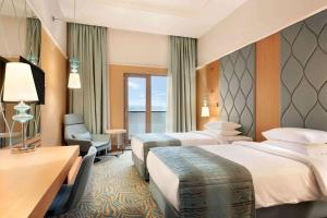 Postel nebo postele na pokoji v ubytování TRYP by Wyndham Izmit