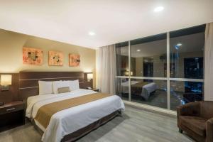 En eller flere senger på et rom på Tryp by Wyndham Panama Centro