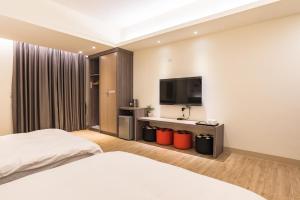 TV a/nebo společenská místnost v ubytování Rhino Guest House + 37 fotografií