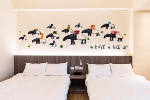 Postelja oz. postelje v sobi nastanitve Rhino Guest House