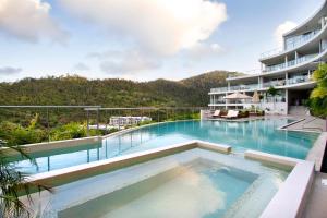 a swimming pool in the middle of a building at Serenity Views in Airlie Beach