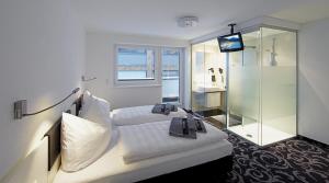 Voodi või voodid majutusasutuse Ischglliving Family Appartements toas