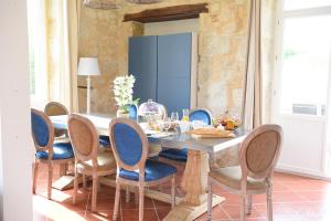 a dining room with a table and chairs at A CLAIREFONTAINE in Auch +23 photos