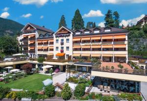 an aerial view of a hotel in the mountains at Dominik Alpine City Wellness Hotel - Adults only in Bressanone