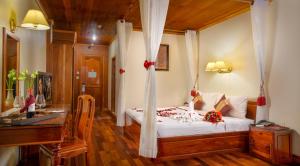 Letto o letti in una camera di Ta Prohm Hotel & Spa
