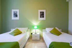 Voodi või voodid majutusasutuse Milanocity MICO MIART toas
