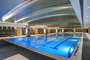 a large swimming pool in a building at Kerry Hotel, Beijing by Shangri-La - 5 Kilometers to The Forbidden City in Beijing