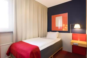 Postel nebo postele na pokoji v ubytování ProfilHotels President